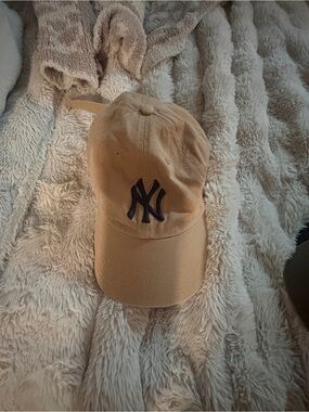 Genuine Merchandise Tan Cap with Black Trim